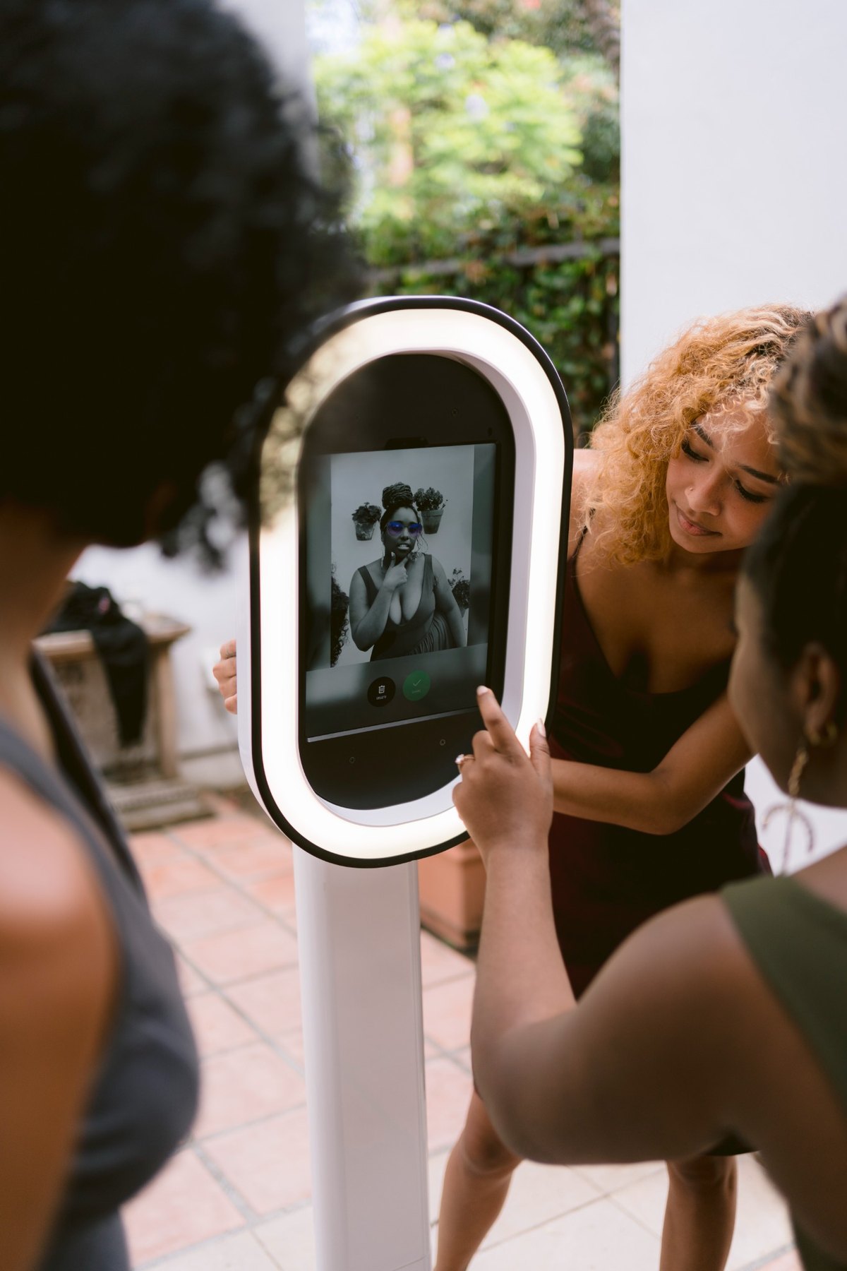 Guests reviewing their photo booth image